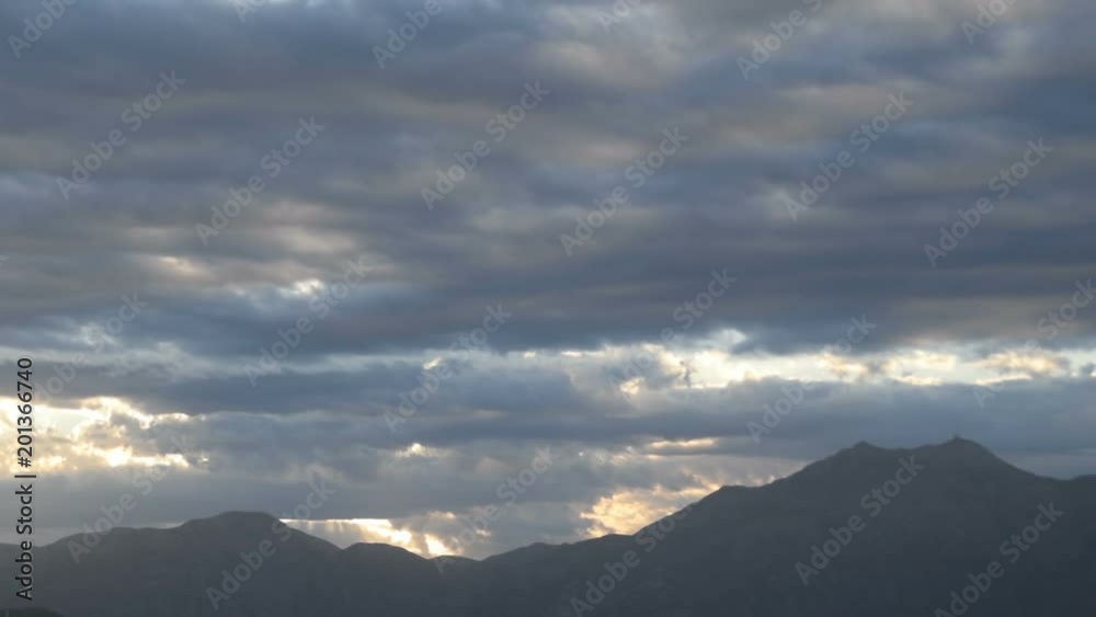 Time lapse of the clouds cape and sunlight over the hills Time lapse of the clouds cape and sunlight over the hills