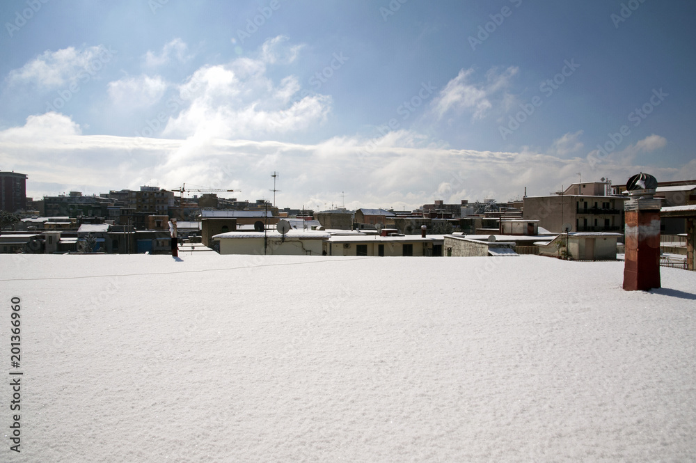 Buildings’ roofs covered with snow: an unexpected snowfall in south Italy