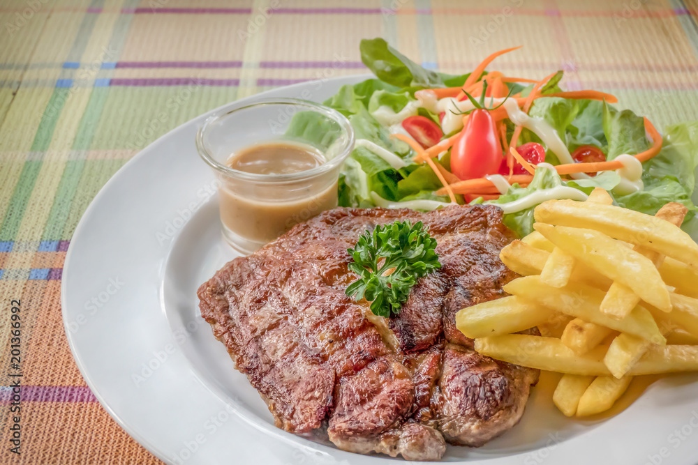 Grilled steak on dish Grilled steak on dish
