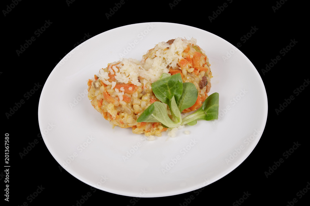 Risotto with carrot and cheese on black Risotto with carrot and cheese on black