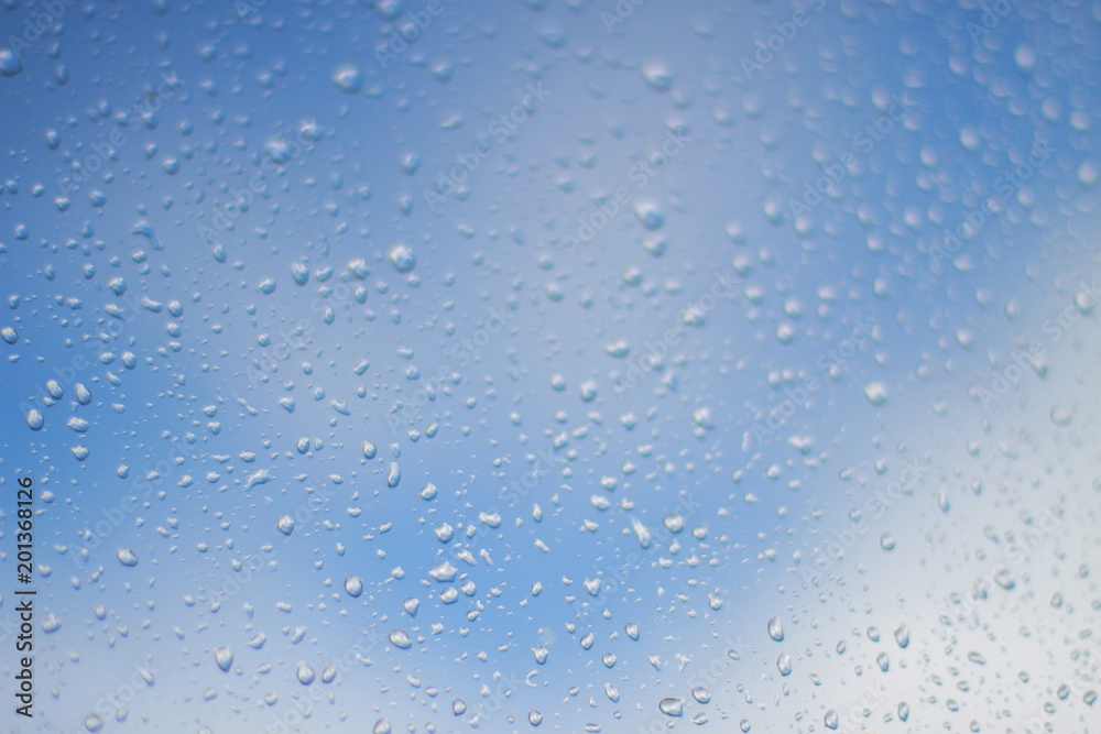 Raindrops on glass close up.