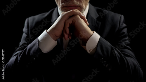 Businessman leaning on elbows, professional lawyer listening patiently to client