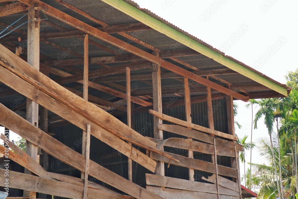Wooden house construction with zinc roof. Industry concept. Wooden house construction with zinc roof. Industry concept.