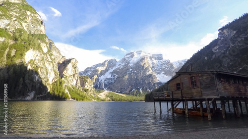 Fisherman house standing near lake in South Tyrol, amazing view of mountains
