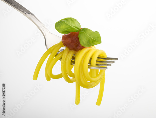 fork with spaghetti and tomato sauce isolated on white background