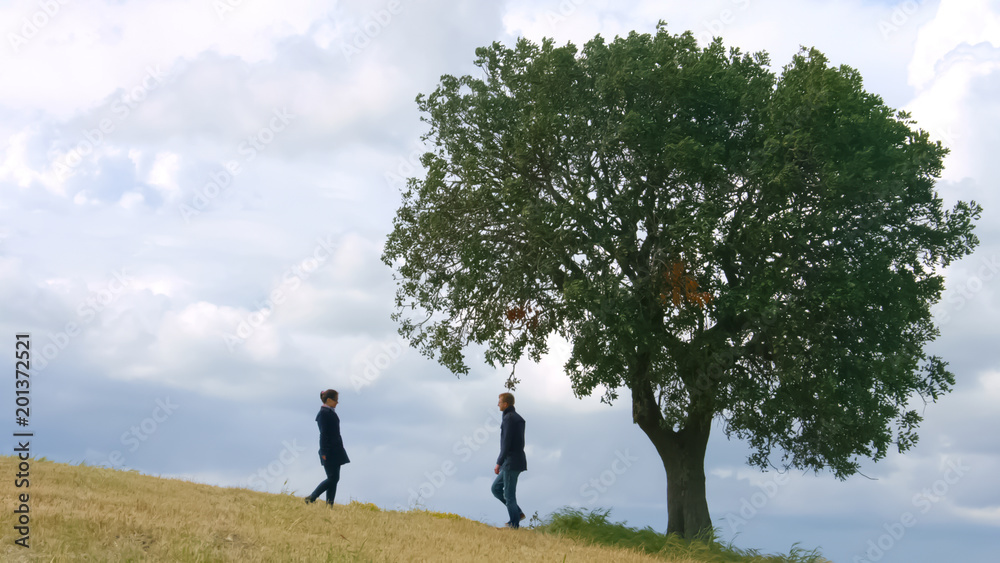 Man rushing on date to his beloved girlfriend, date in beautiful autumn place Man rushing on date to his beloved girlfriend, date in beautiful autumn place
