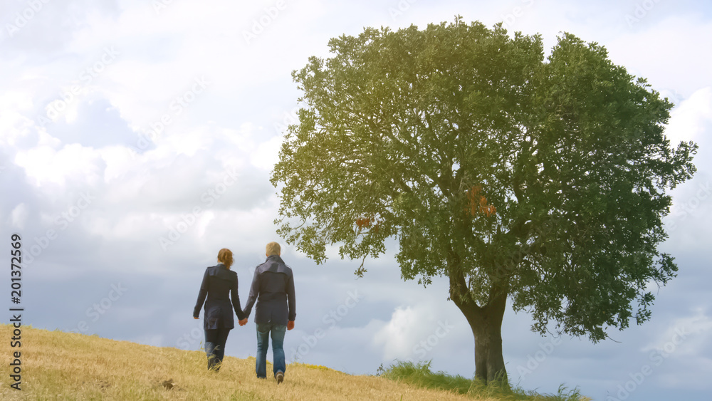 Romantic couple holding hands, walking life journey together, family planning Romantic couple holding hands, walking life journey together, family planning