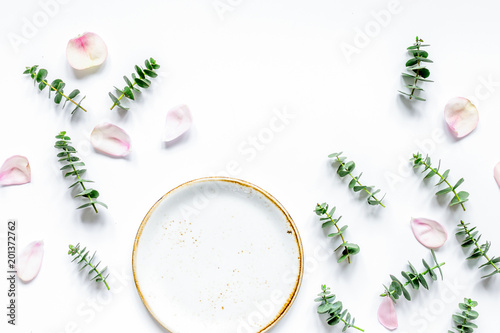 woman table with flower and herbs top view white background mock