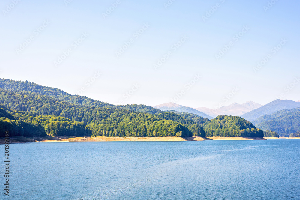 Daylight view to Vidraru lake in Carpathian Mountains
