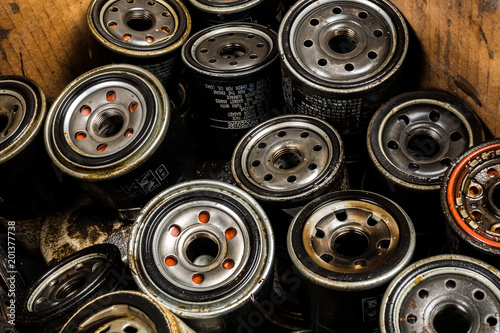 Picture of old car oil filters represented in automobile service center. Old fuel filters of diesel engines.