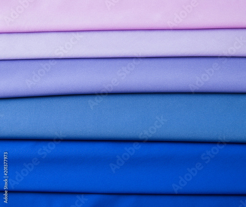 Multicolored folds of blue, blue, lilac and pink fabric