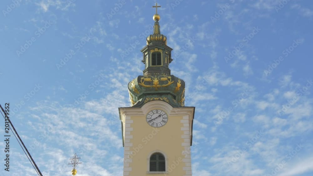 The top of a church clock tower The top of a church clock tower