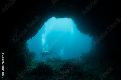 Deep Cave and Scuba Diver in Raja Ampat