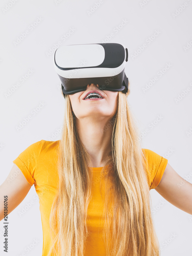 Girl wearing virtual reality goggles. Girl wearing virtual reality goggles.