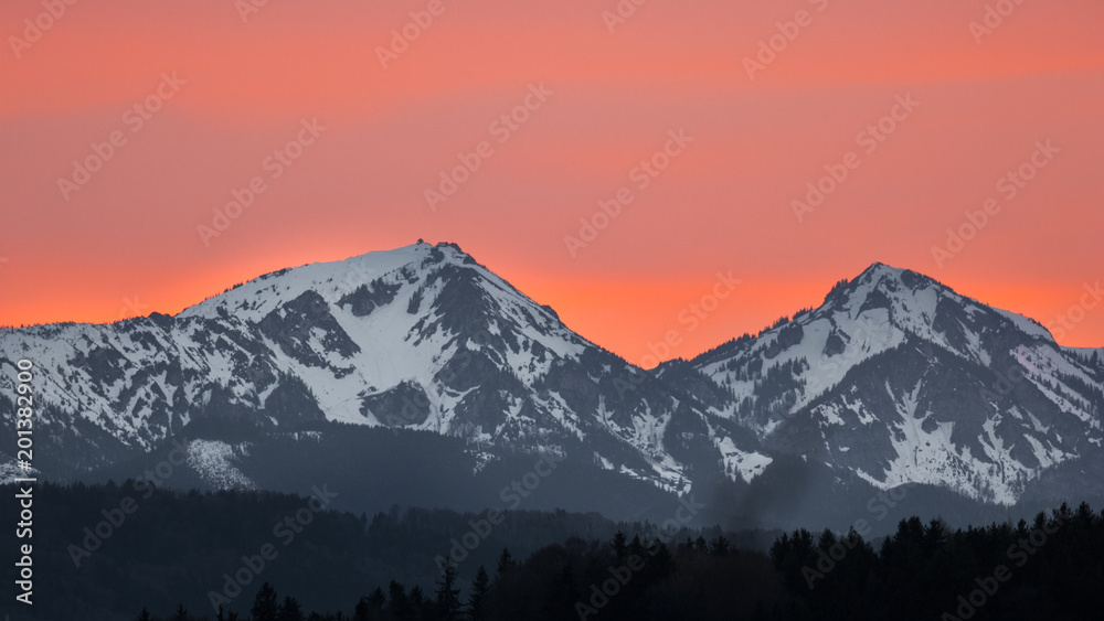Colorful sunset over the Alps with Sahara Sand in the air