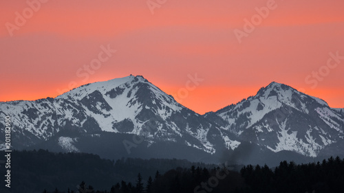 Colorful sunset over the Alps with Sahara Sand in the air © naturenow