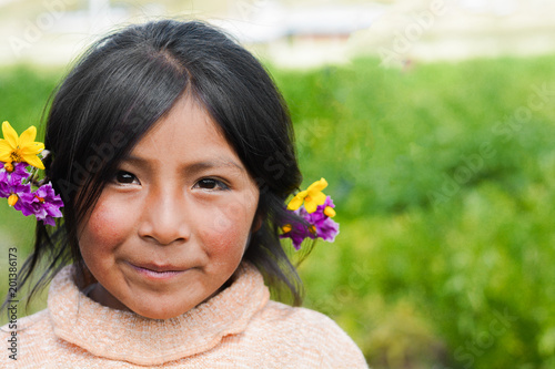Obraz na plátně Beautiful native american little girl with flowers in her hair.