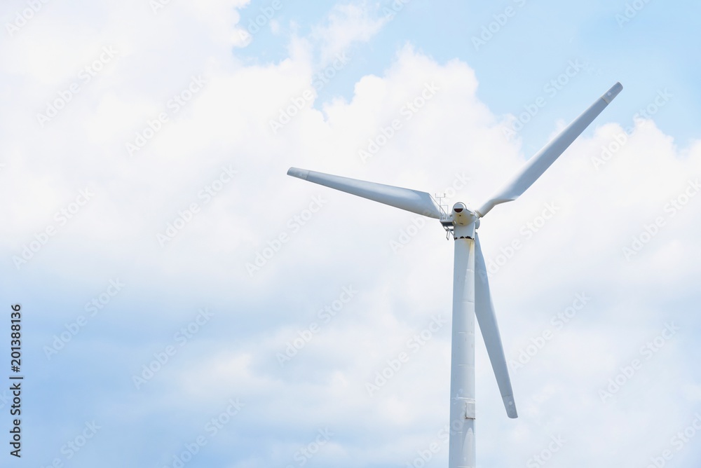 Wind Turbine, a Source of Renewable Energy, Isolated Against Blue Skies Wind Turbine, a Source of Renewable Energy, Isolated Against Blue Skies