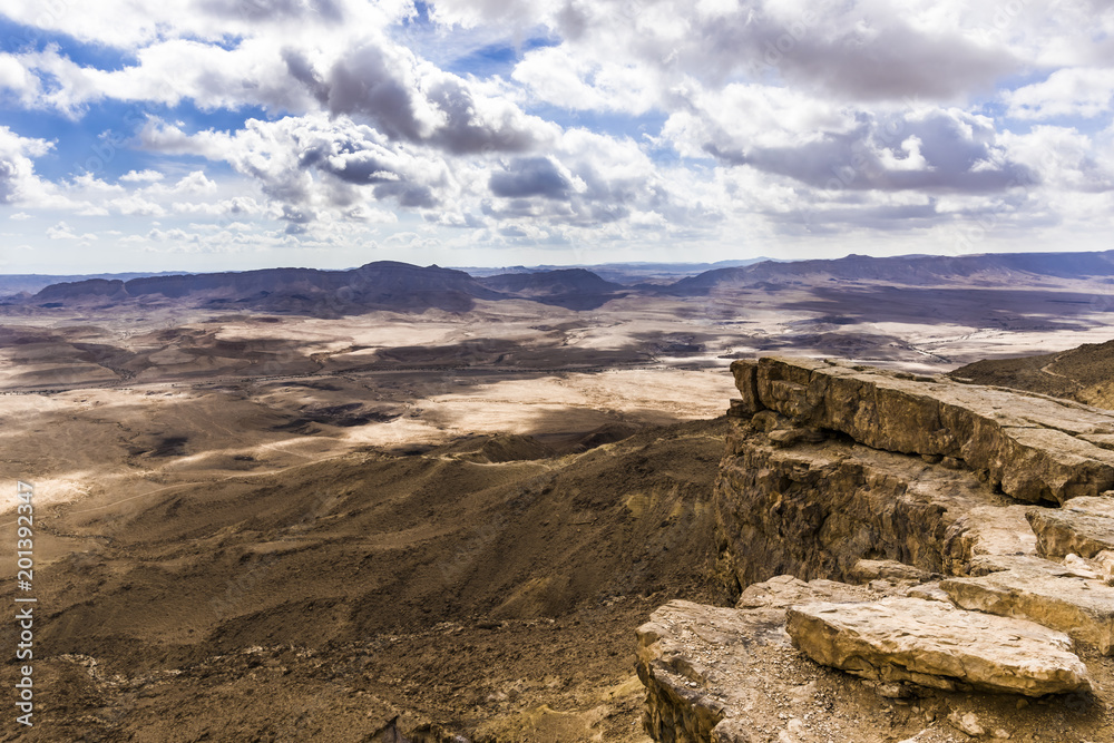 Clouds over a rocky plateau in the Negev desert Clouds over a rocky plateau in the Negev desert