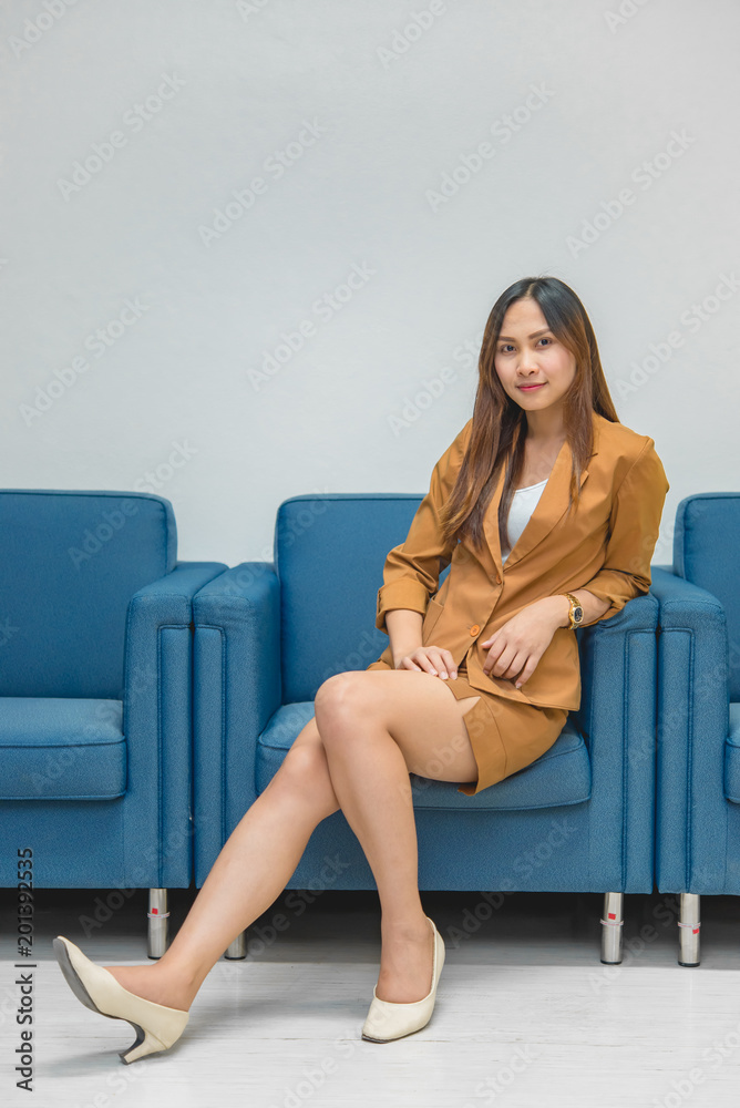 Portrait of beautiful asian business woman wear yellow dress in a office,Thailand people wear ladies uniforms office,Sexy woman on sofa Portrait of beautiful asian business woman wear yellow dress in a office,Thailand people wear ladies uniforms office,Sexy woman on sofa