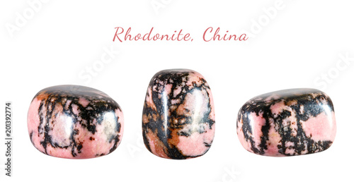 Macro shooting of natural gemstone. The raw mineral is rhodonite, China. Isolated object on a white background.