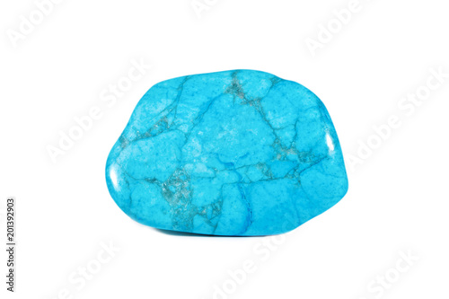 Macro shooting of natural gemstone. Natural mineral gem stone - turkvenit -blue howlite gemstone. Isolated object on a white background.