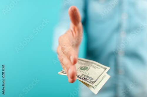 Man giving a hundred dollar bill