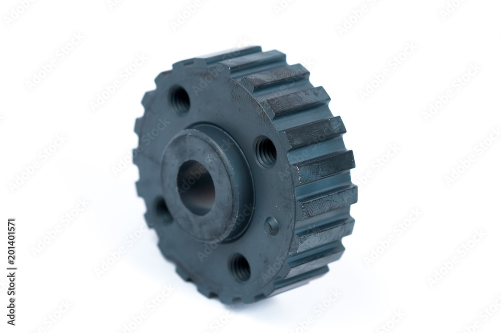 Close-up of a crankshaft gear on an isolated white background. New spare parts Close-up of a crankshaft gear on an isolated white background. New spare parts