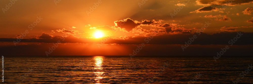 beutiful orange sunset on the calm sea - obrazy, fototapety, plakaty 