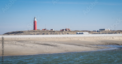 Old lighthouse on the beach of De Cocksdorp, The Netherlands.