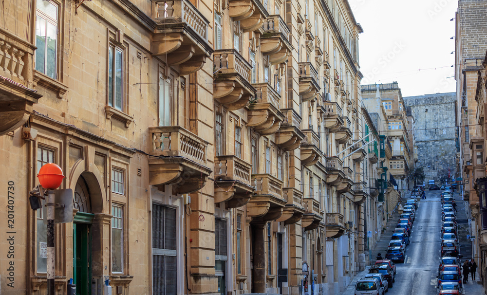 Malta, Valletta, building facade with balconies, perspective view