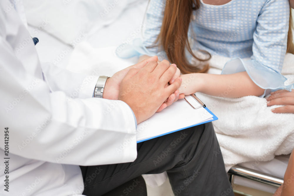 Health Concepts. The doctor is examining the health of the child. The doctor is talking to the patient. Children are happy in the hospital. Health Concepts. The doctor is examining the health of the child. The doctor is talking to the patient. Children are happy in the hospital.