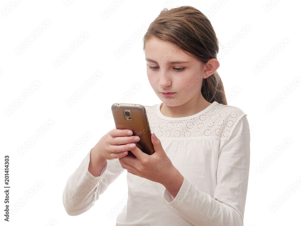 Girl checking something on her smartphone, white shirt, white background. Girl checking something on her smartphone, white shirt, white background.