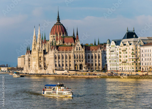 Touristc river barge on the danube in front of the Parliament of Budapest photo