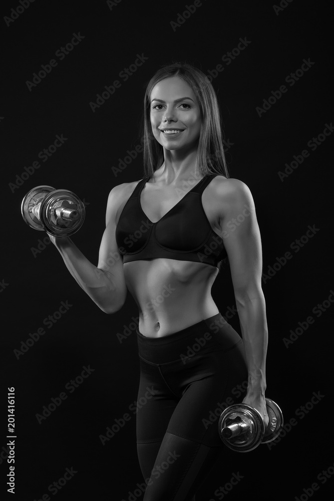 fitness woman in doing exercises with dumbells. fitness woman in doing exercises with dumbells.