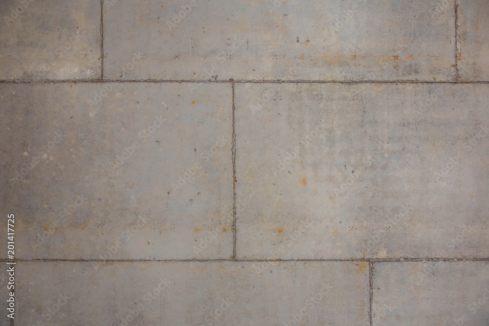 Concrete wall of gray color from fragments. Abstract background Concrete wall of gray color from fragments. Abstract background