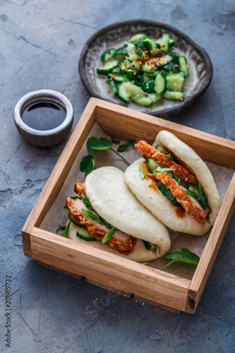 Gua bao, chinese steamed buns, with pork belly in a wooden box photo