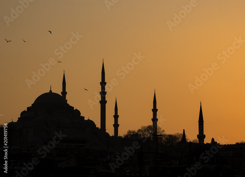 Silhouette of the old town - Sultanahmet mosques in setting sun in Istanbul Turkey. Istanbul old town has many mosques to give a silhouette of minarets