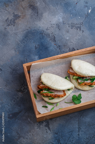 Chinese steamed buns with pork belly, top view, place for wording photo