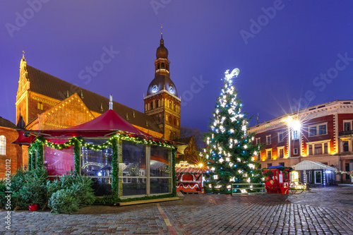 Decorated and illuminated Christmas tree, Christmas Market and the Cathedral of Saint Mary at Cathedral Square, Doma laukums, Riga, Latvia.