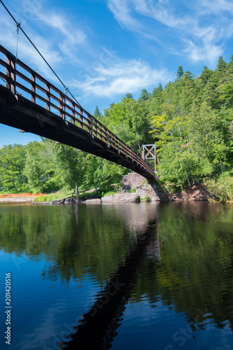 Swinging bridge over the mouth of the Black River in Michigan n