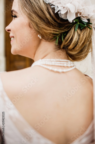 Bride with wedding makeup and hairstyle. Smiling bride. Wedding 