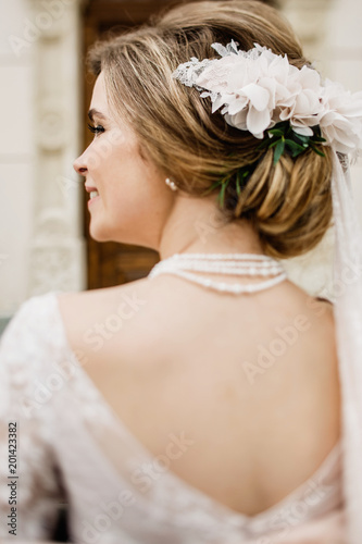 Bride with wedding makeup and hairstyle. Smiling bride. Wedding  © VAKSMANV