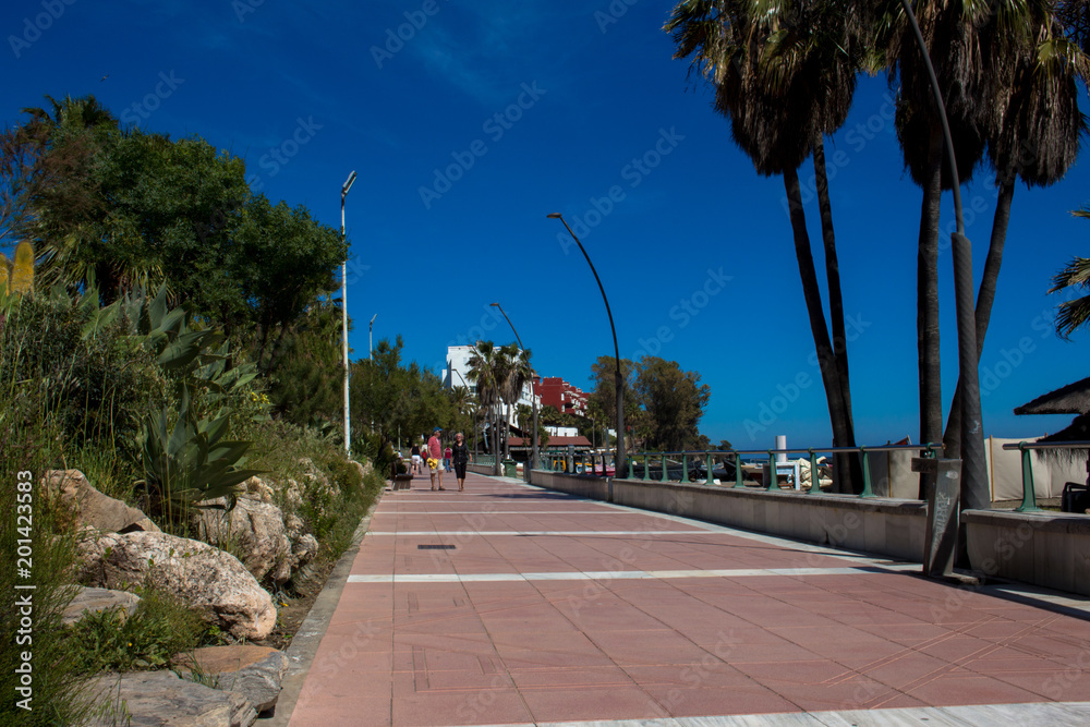 Estepona. A sunny day in the street of Estepona. Malaga, Costa del Sol, Andalusia, Spain. Picture taken – 18 april 2018. Estepona. A sunny day in the street of Estepona. Malaga, Costa del Sol, Andalusia, Spain. Picture taken – 18 april 2018.