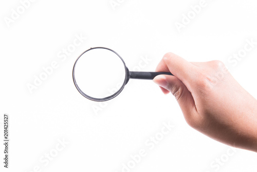 Female hand with magnifying glass.