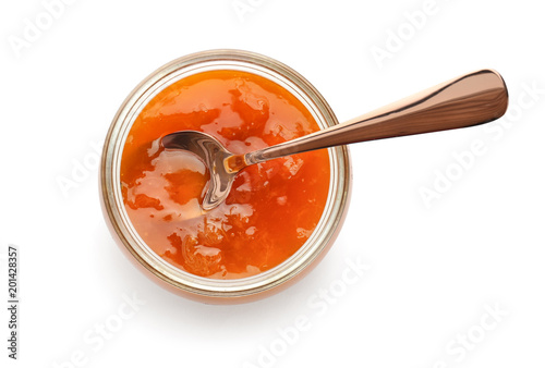 Jar with sweet jam on white background photo