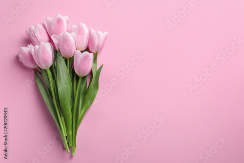 Beautiful tulips for Mother's Day on color background, top view © New Africa