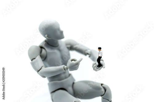 Model robot with miniature people young businessman Business and technology.