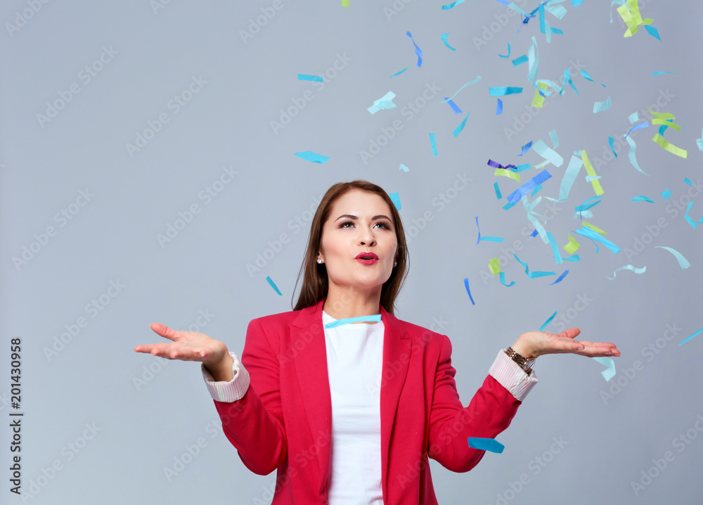 Beautiful happy woman at celebration party with confetti .Birthday or New Year eve celebrating concept. Beautiful happy woman at celebration party with confetti .Birthday or New Year eve celebrating concept.