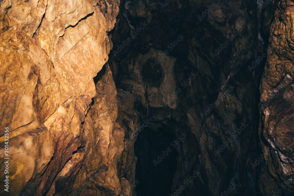 The beginning of the underground tunnel. Entrance to the dark cave. The beginning of the underground tunnel. Entrance to the dark cave.
